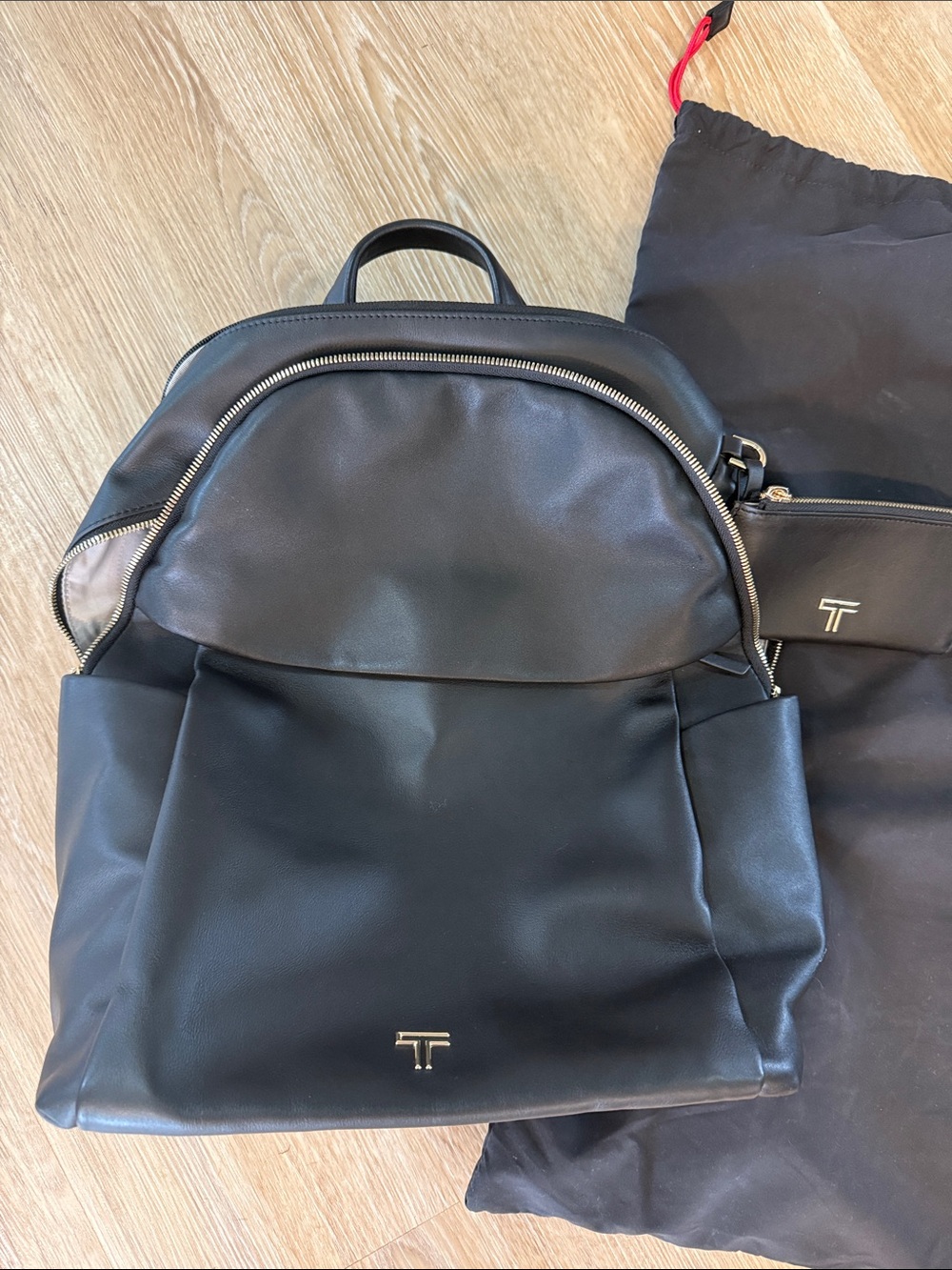 Tumi Black Leather Backpack with Gold Hardware